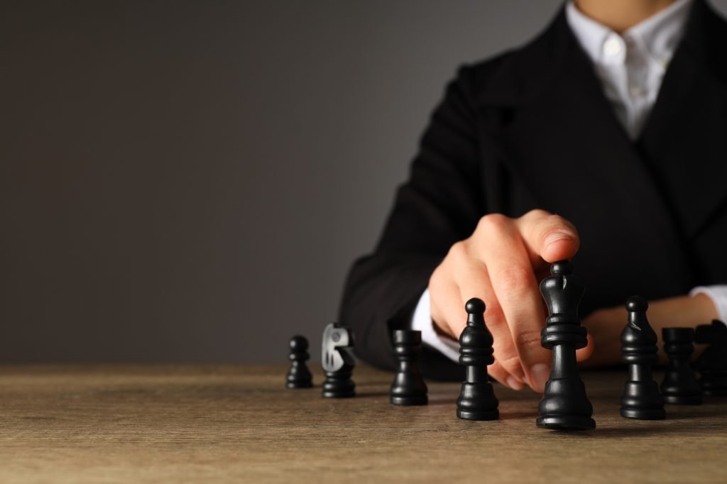 strategic chess move by businesswoman on wooden ta 2026 03 24 23 30 01 utc 1